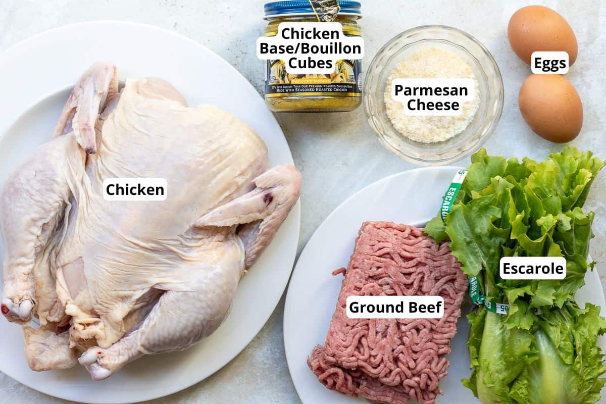 Ingredients for Italian Wedding Soup including chicken, escarole, and Parmesan