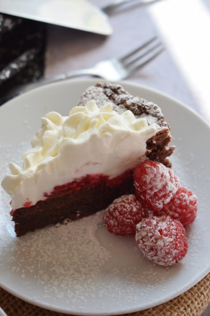 Chocolate raspberry torte slice.
