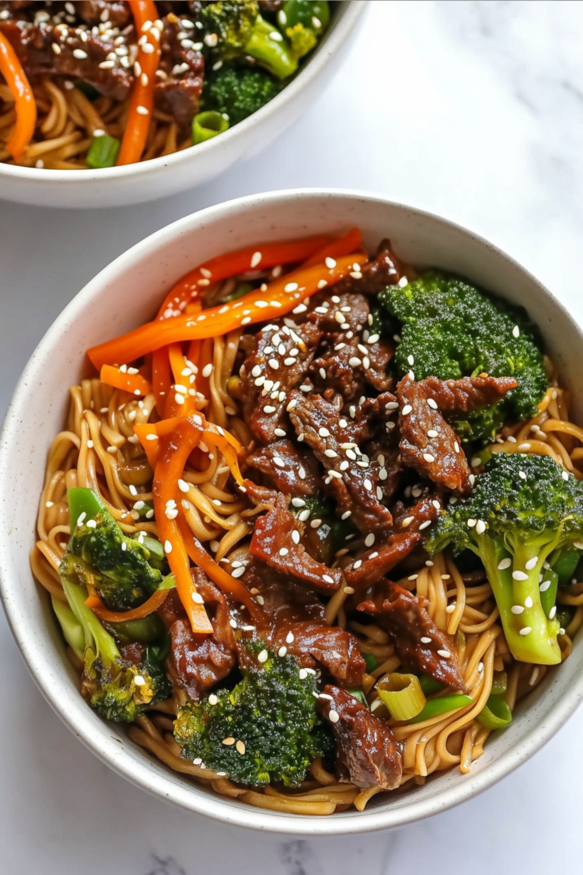 A hearty portion of beef and broccoli lo mein with perfectly cooked noodles.