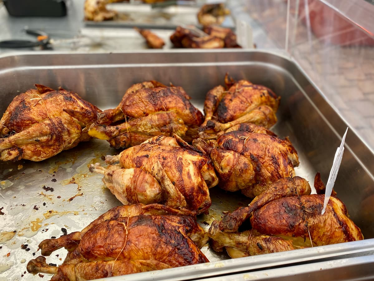 Whole roasted chickens in a French market