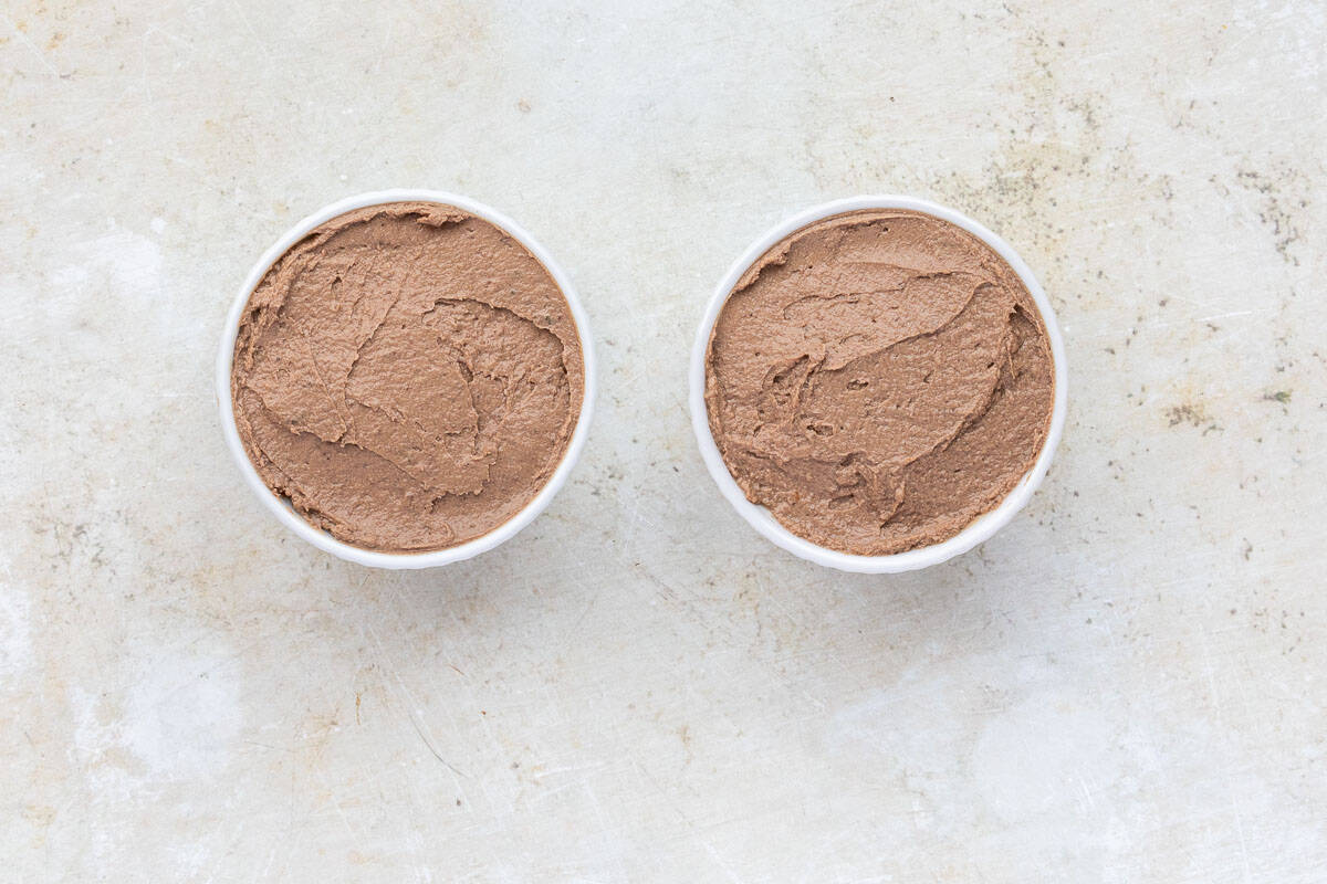 Two ramekins with chicken liver pâté.