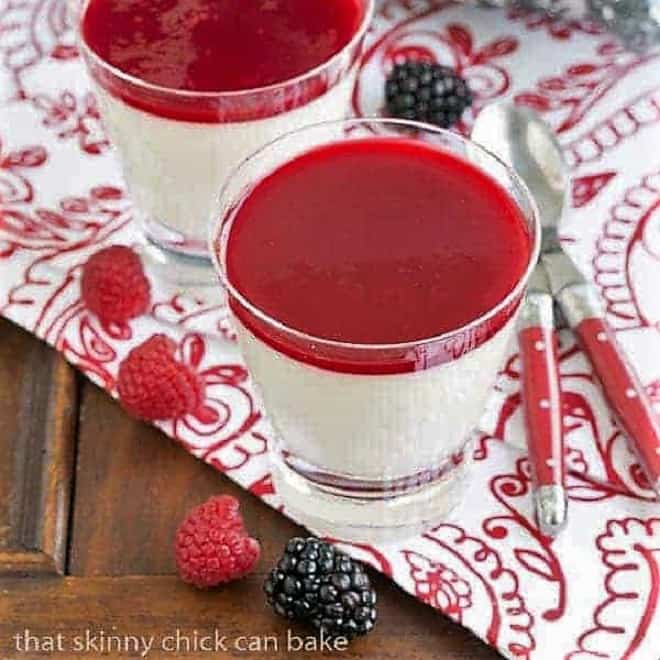 Vanilla Bean Panna Cotta in glasses topped with fresh berries