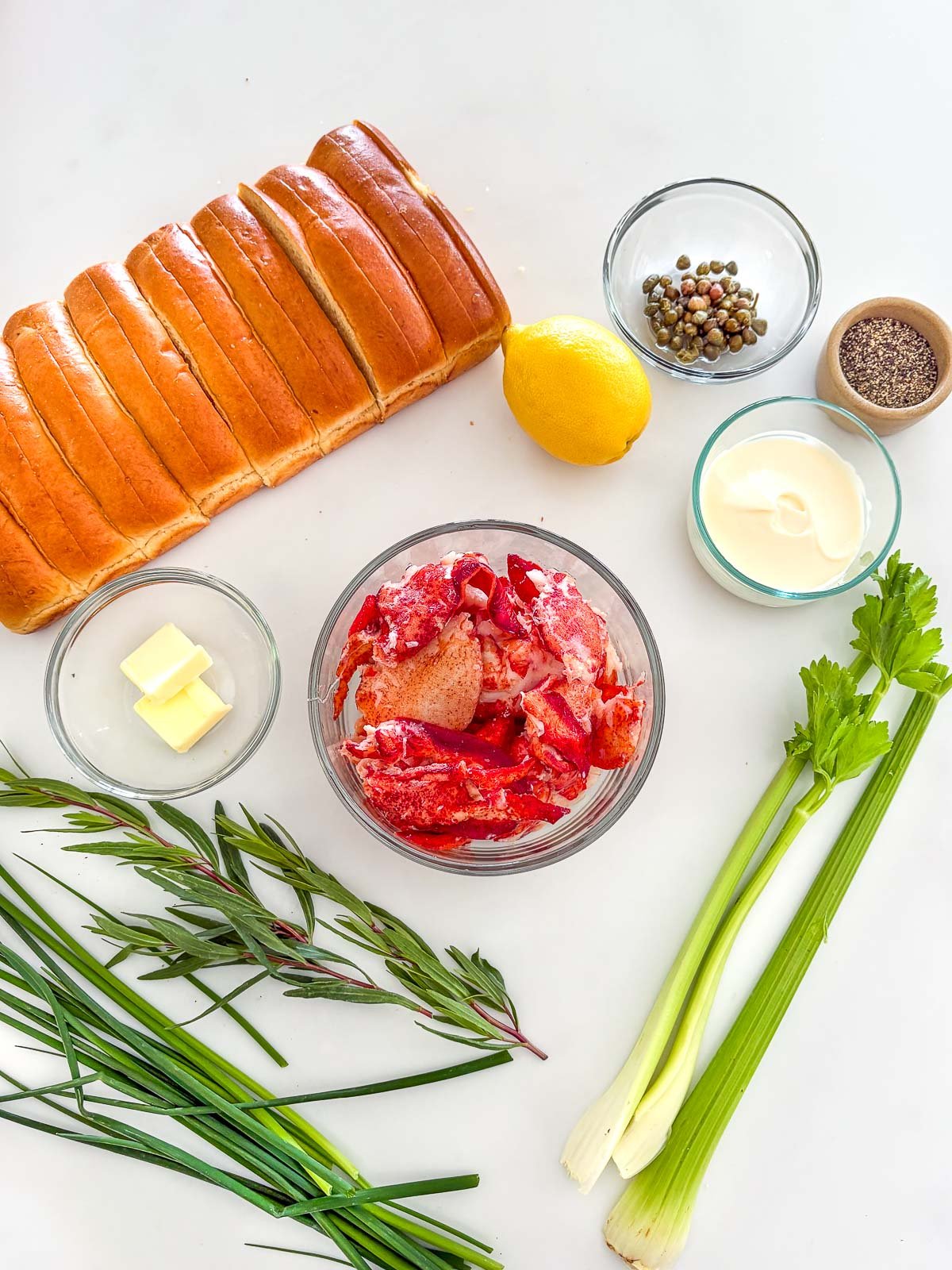 Ingredients for lobster rolls arranged neatly.