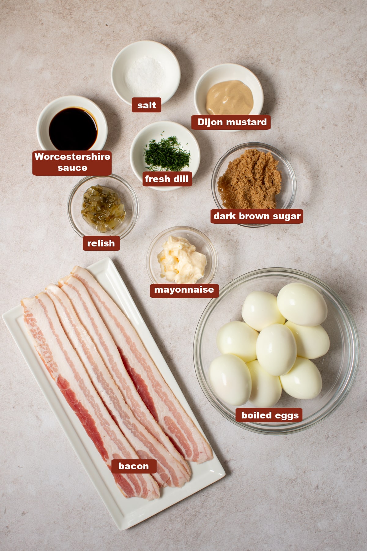 A collection of all ingredients for deviled eggs with candied bacon.