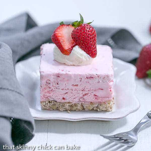 Strawberry Pie Dessert slice on a plate with a gray napkin.