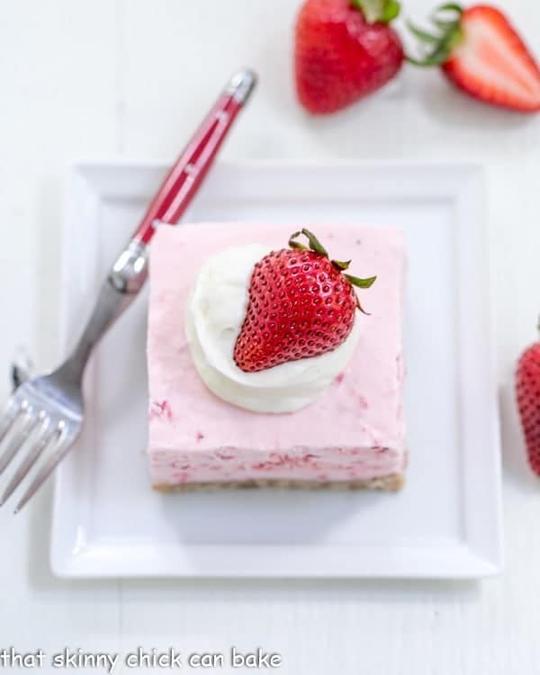 Overhead view of a slice of Strawberry Pie Dessert with a red handled fork.