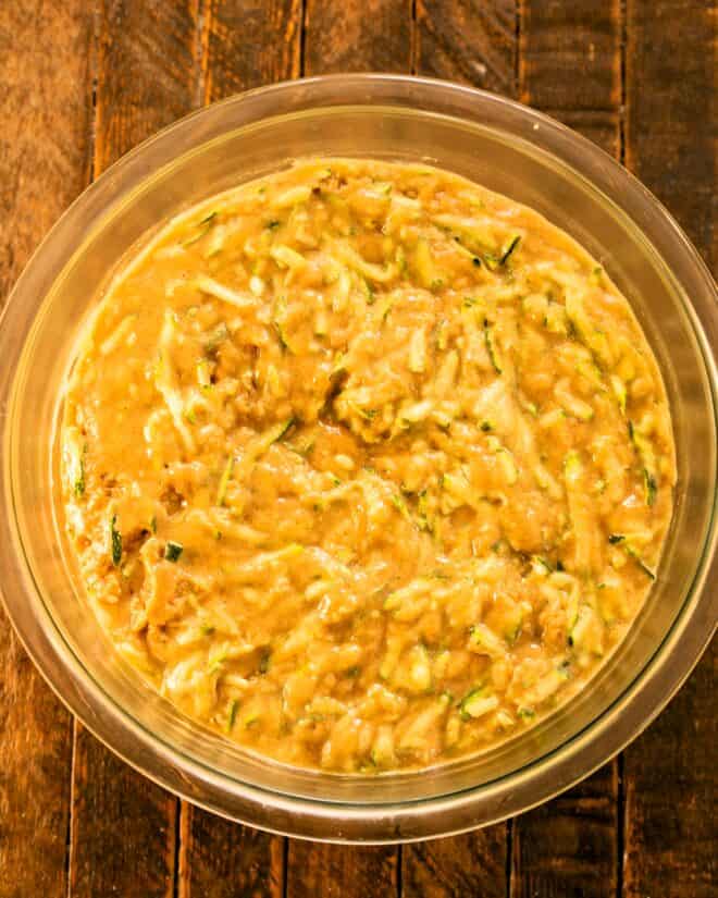 Incorporating shredded zucchini.