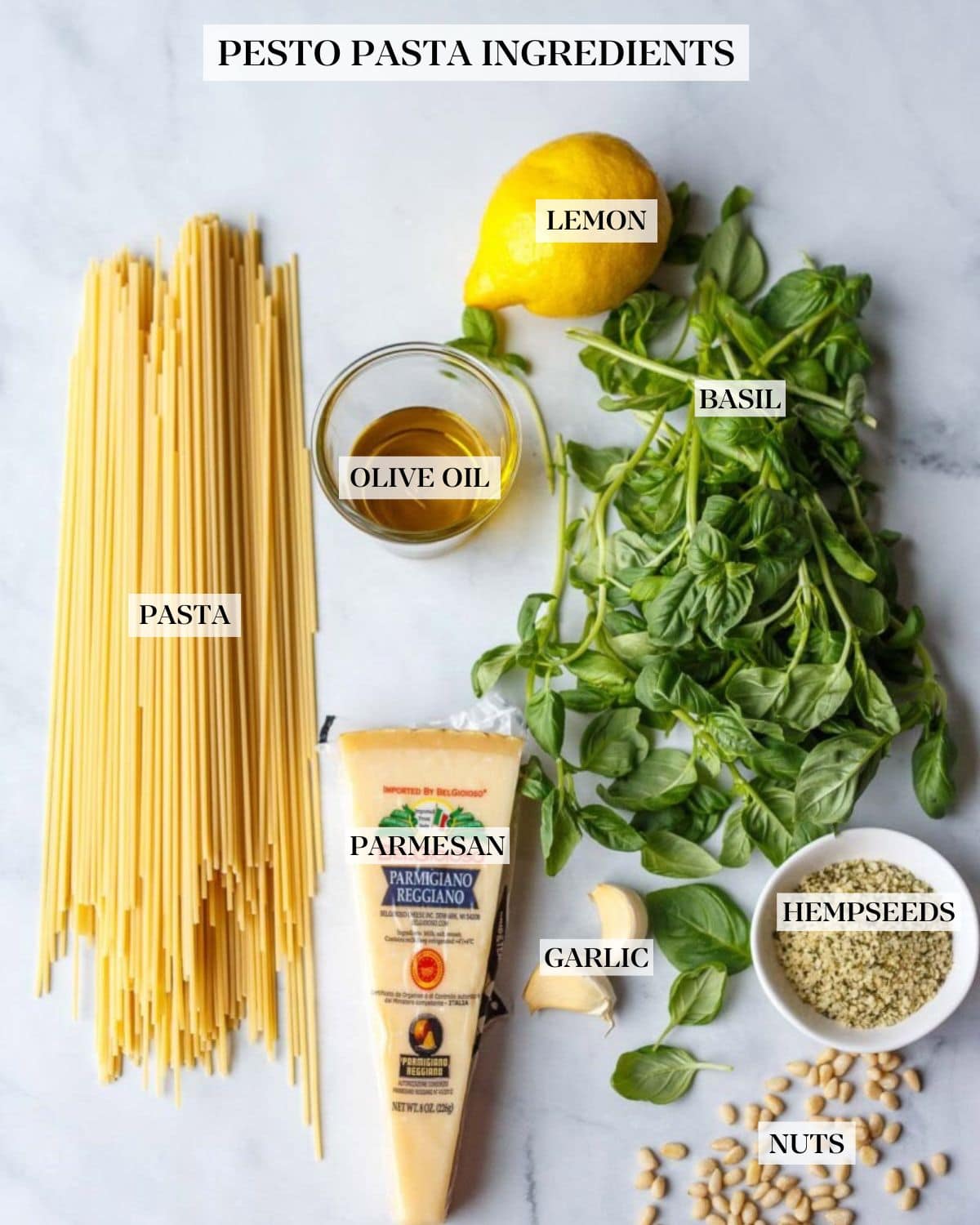 Ingredients for pesto pasta arranged neatly and labeled