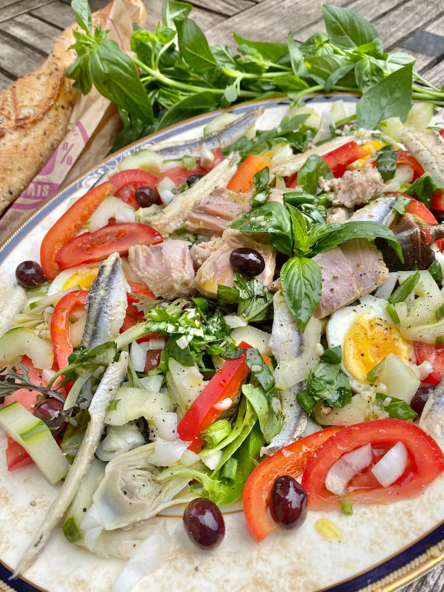 Composed plate of a colourful French classic Niçoise salad