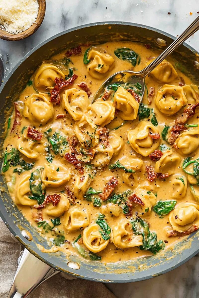Marry Me Tortellini with sun-dried tomatoes and spinach.