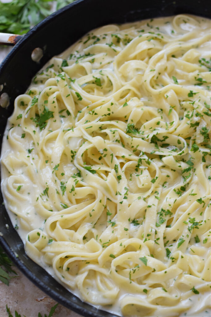 Close up of tagliatelle in a cream sauce.
