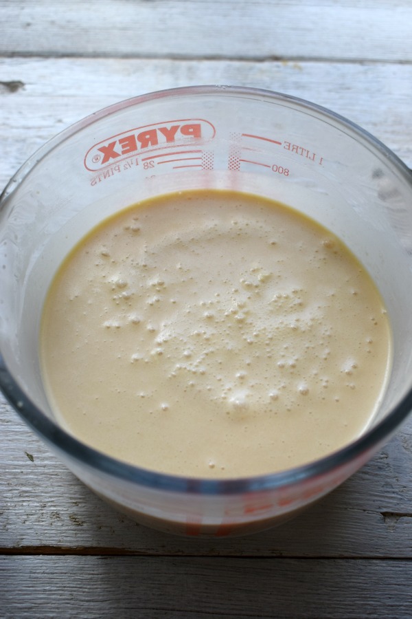 Crepe batter in a glass bowl.