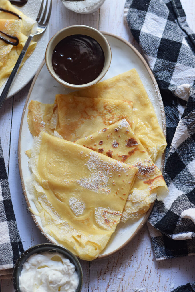 Crepes on a small platter.