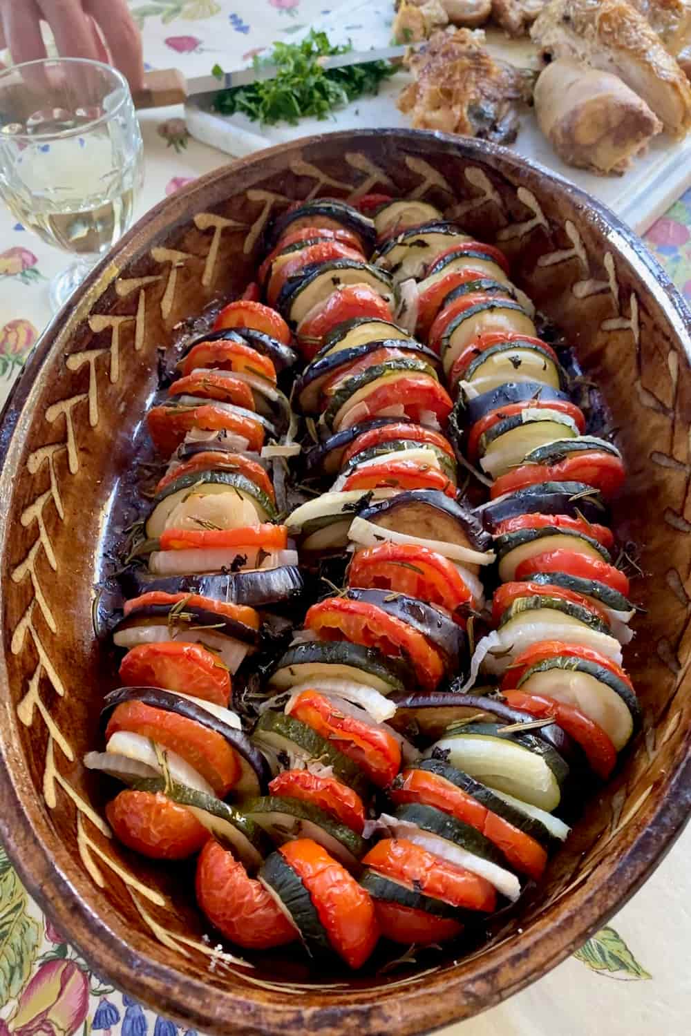 Tian dish of layered roasted summer vegetables with herbs