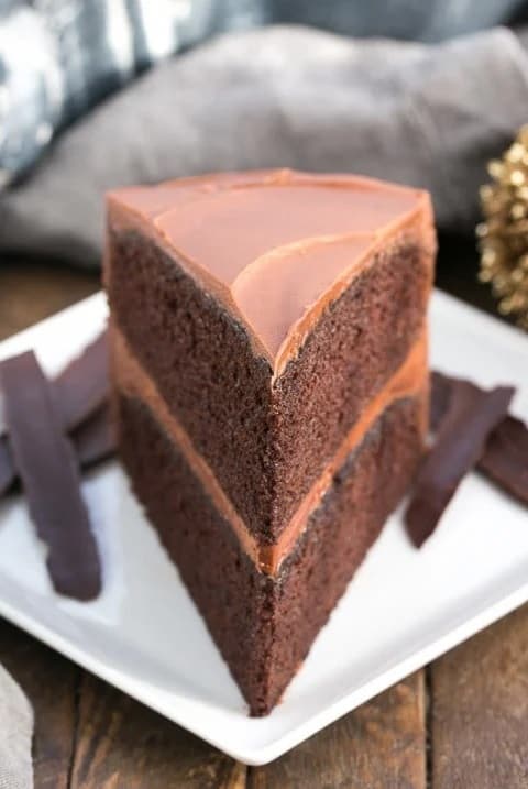 Slice of chocolate mayonnaise cake on a white plate