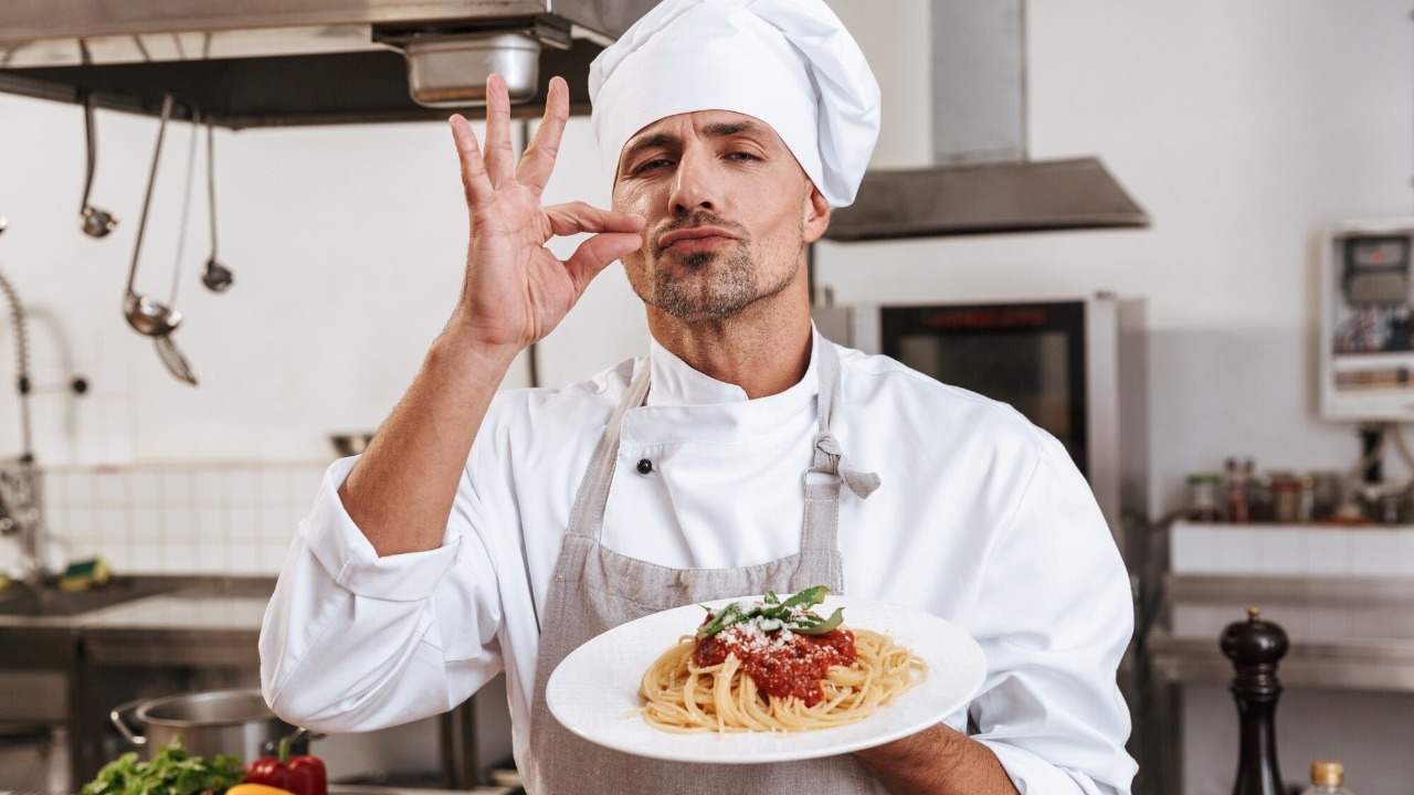 Image of a chef tasting food